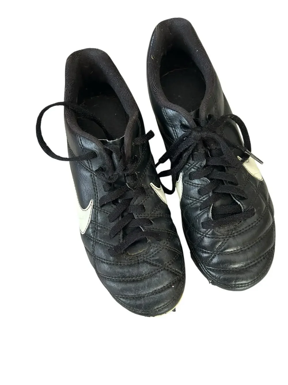 Nike black and white cleats size 2.5